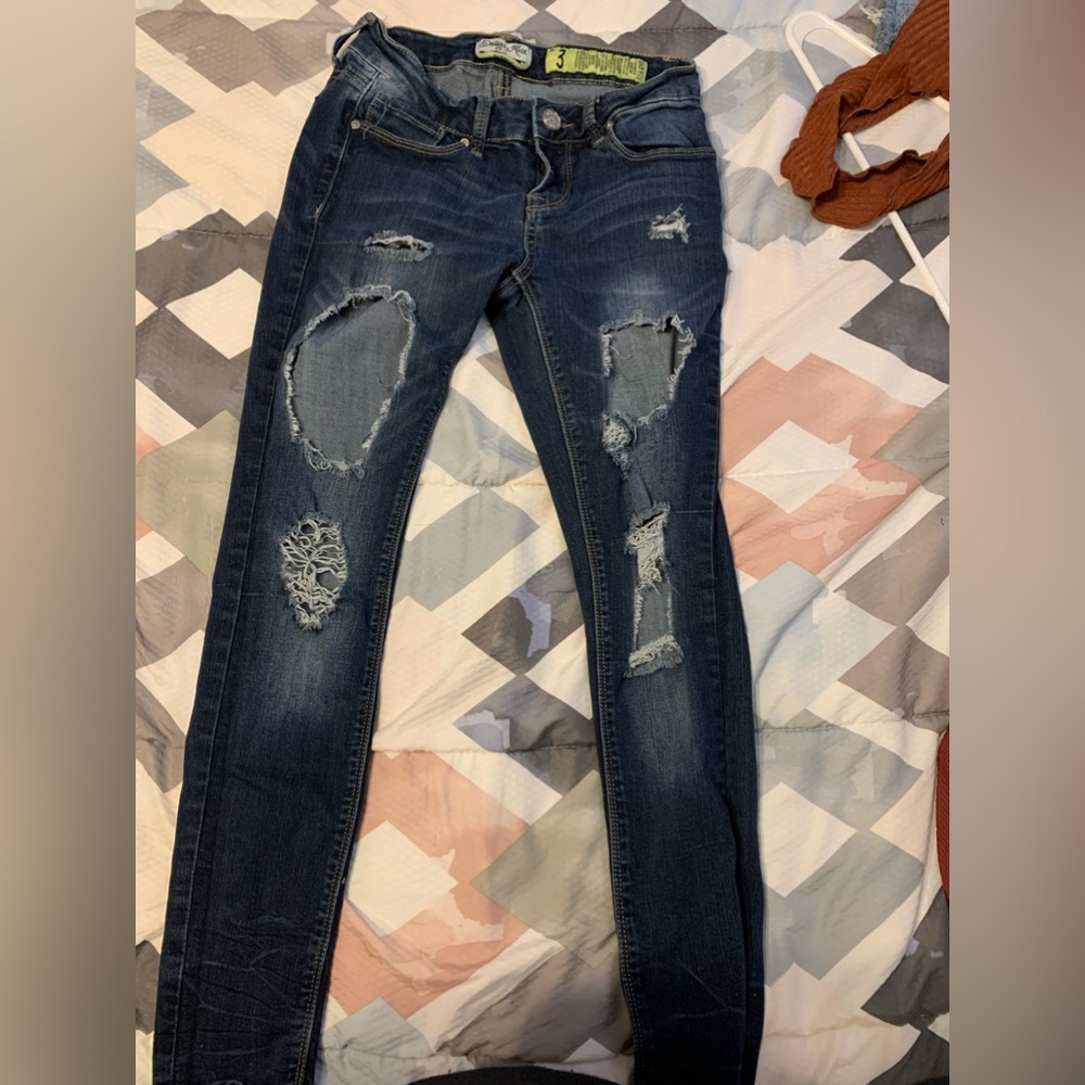 Ripped Dark Colored Jeans
